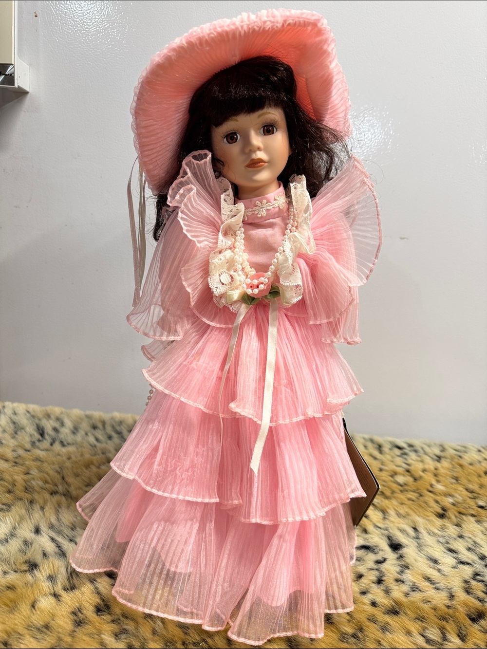 Porcelain Collectible Doll in Pink Ruffle Dress and Hat